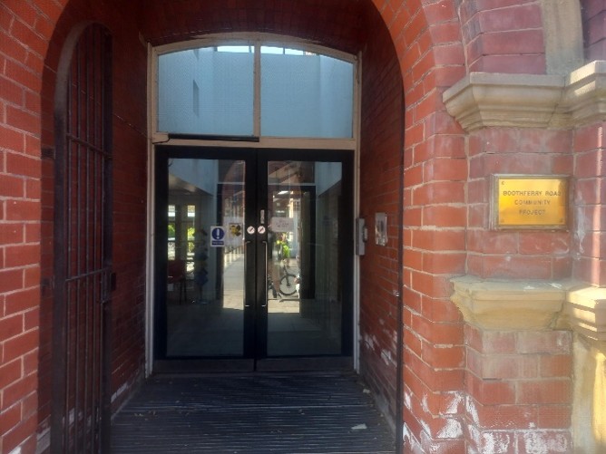 The entrance to the Courtyard venue is through a brick archway and there are large glass doors