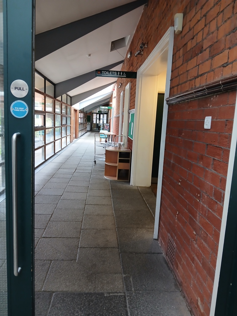 The corridor showing the entrance to the toilets on the right