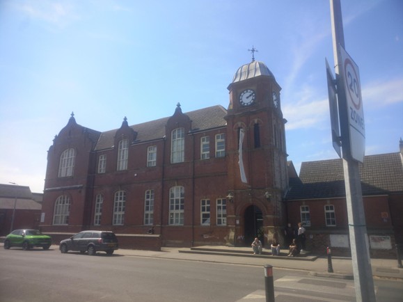 Goole Courtyard is a large Victorian era brick building with a clocktower