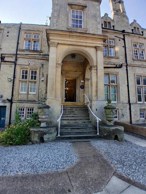 A path leading to a stone staircase with handrails either side.